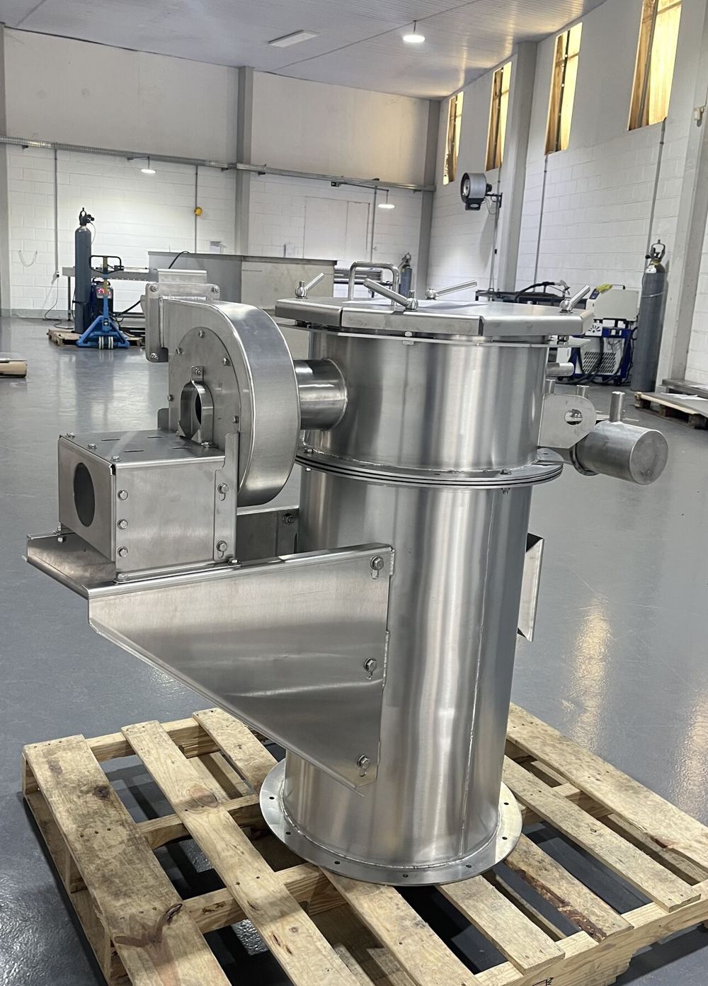Stainless steel equipment built by Project Laser, on a pallet